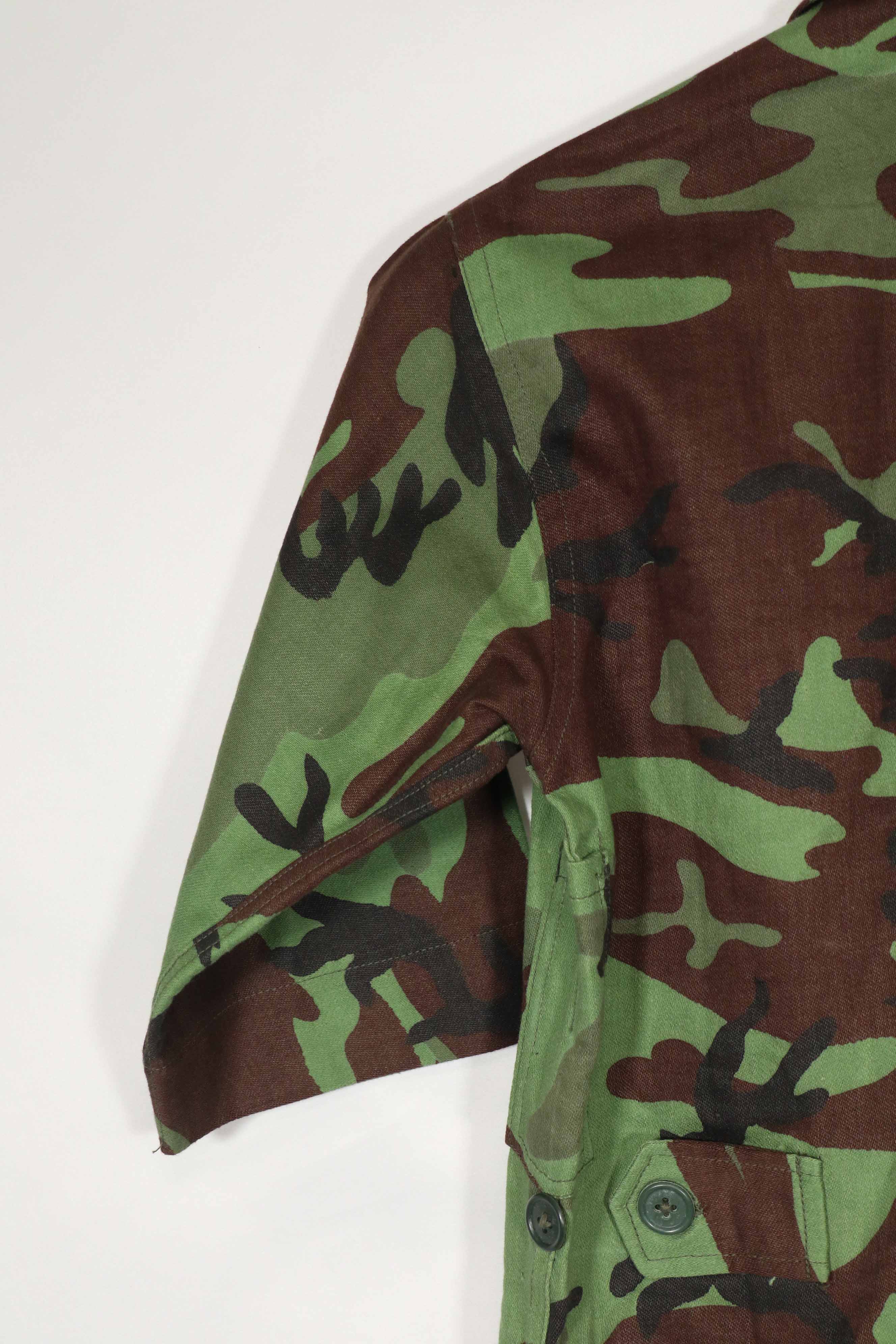 Real Unused South Vietnamese Ranger leaf camouflage jacket with short sleeves.