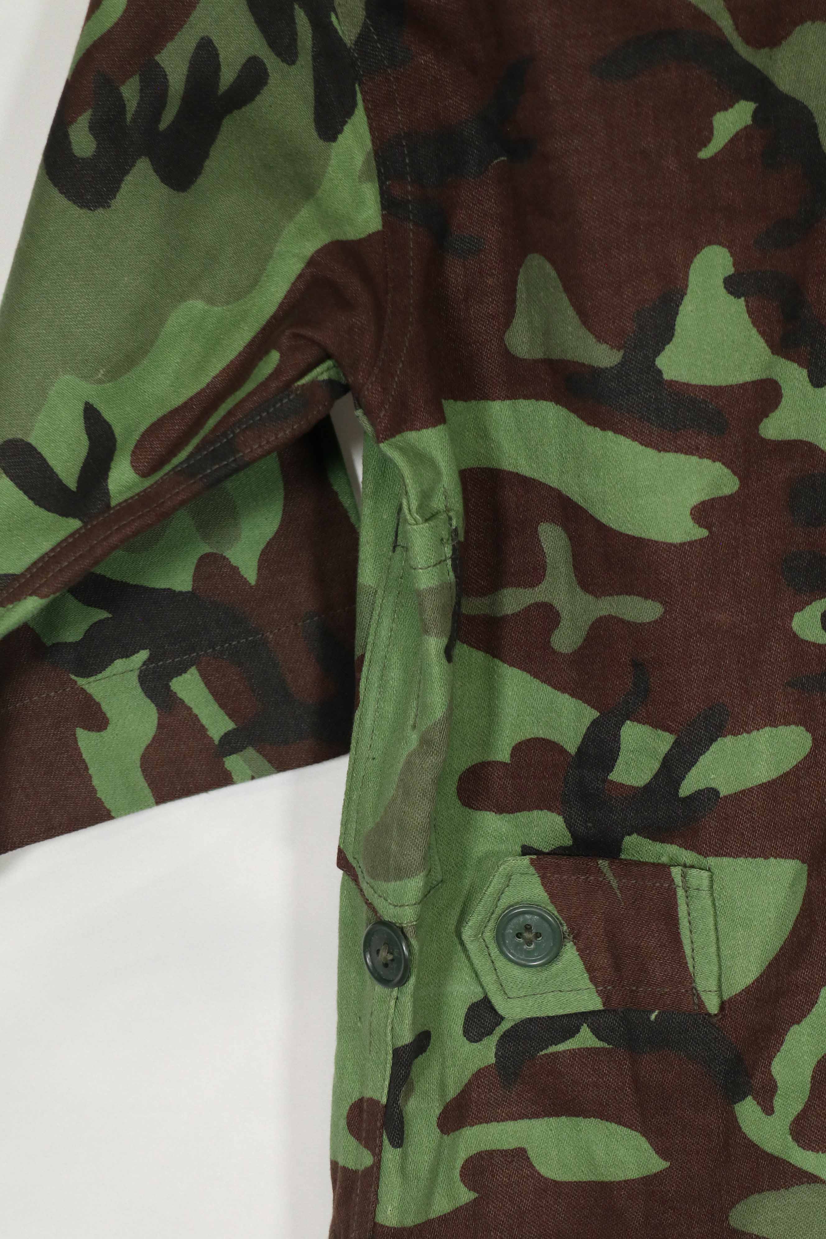 Real Unused South Vietnamese Ranger leaf camouflage jacket with short sleeves.