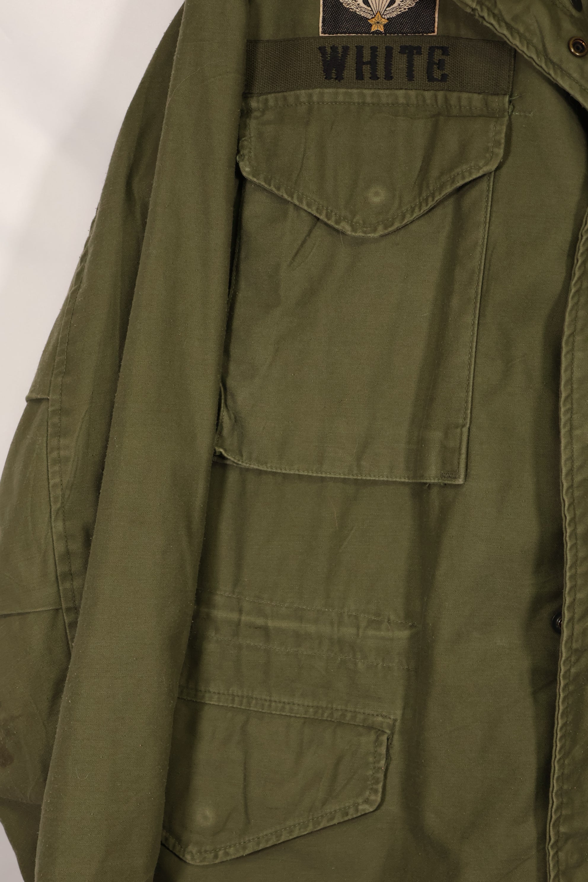 Real owned by former SF member, first model M65 field jacket, estimated 1965-1966, used.