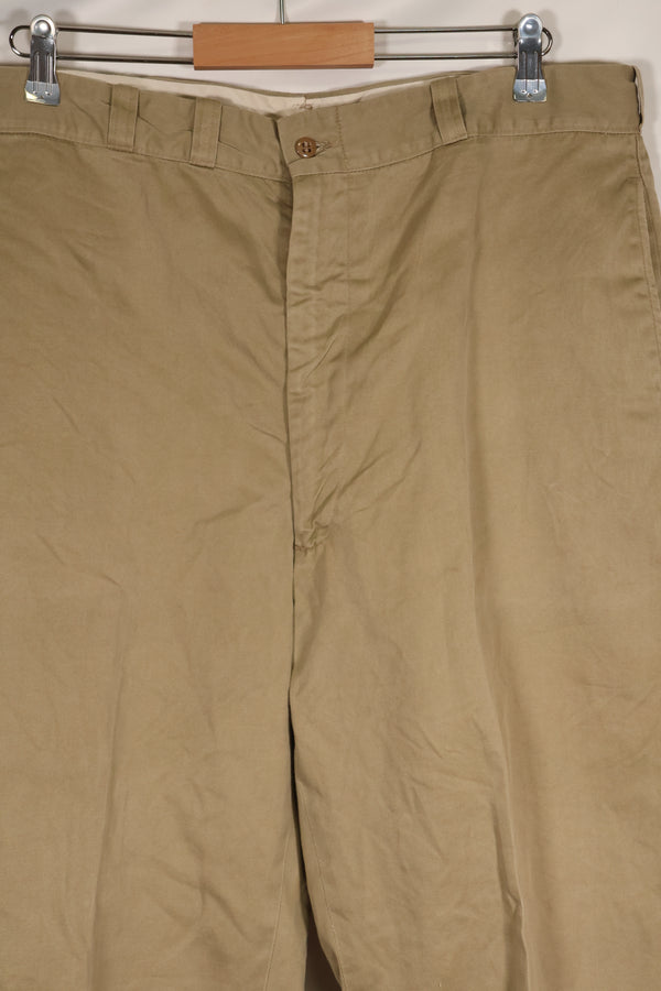 1960s, estimated 34-36 US Army cotton khaki pants, used.