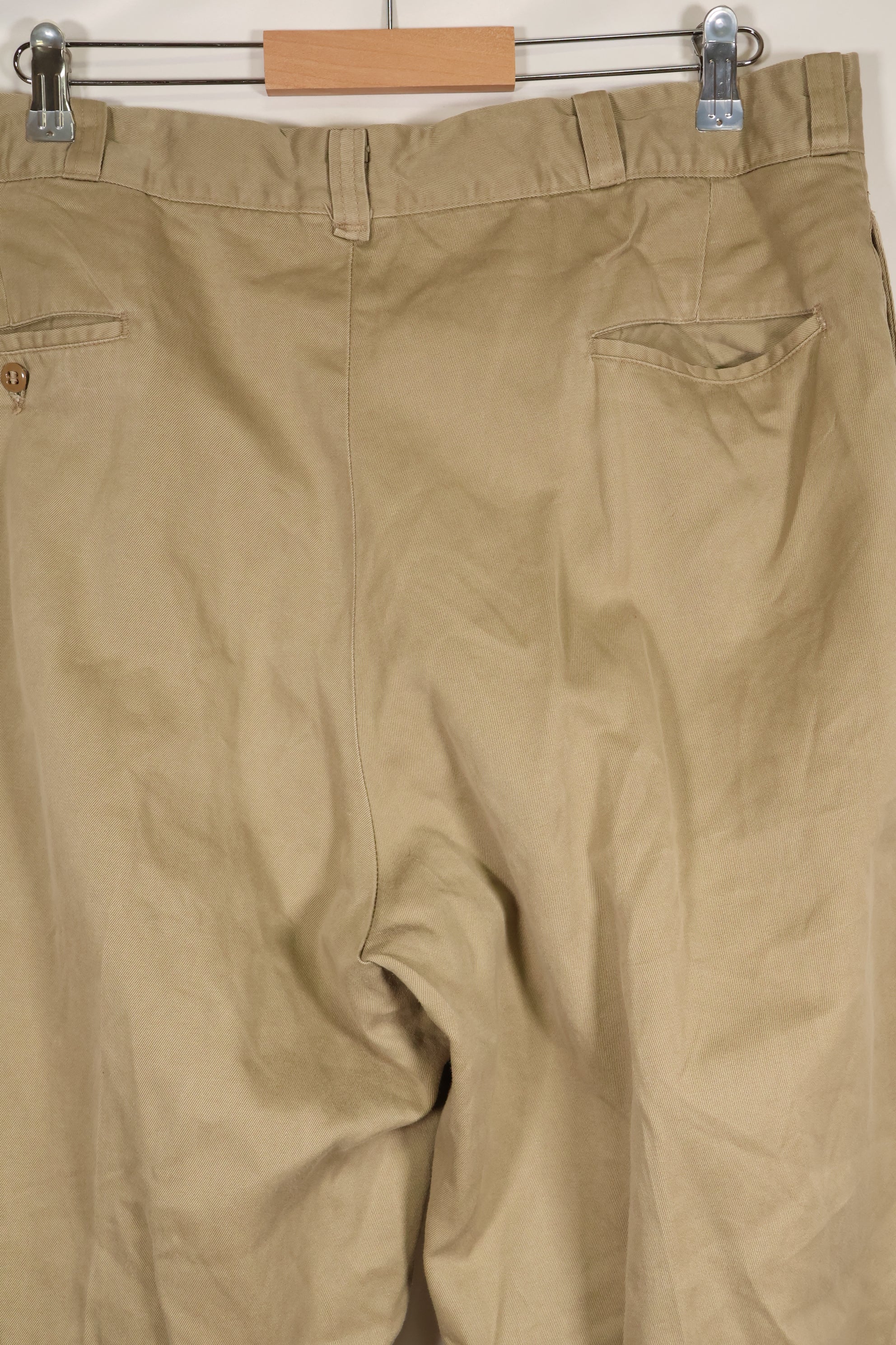 1960s, estimated 34-36 US Army cotton khaki pants, used.
