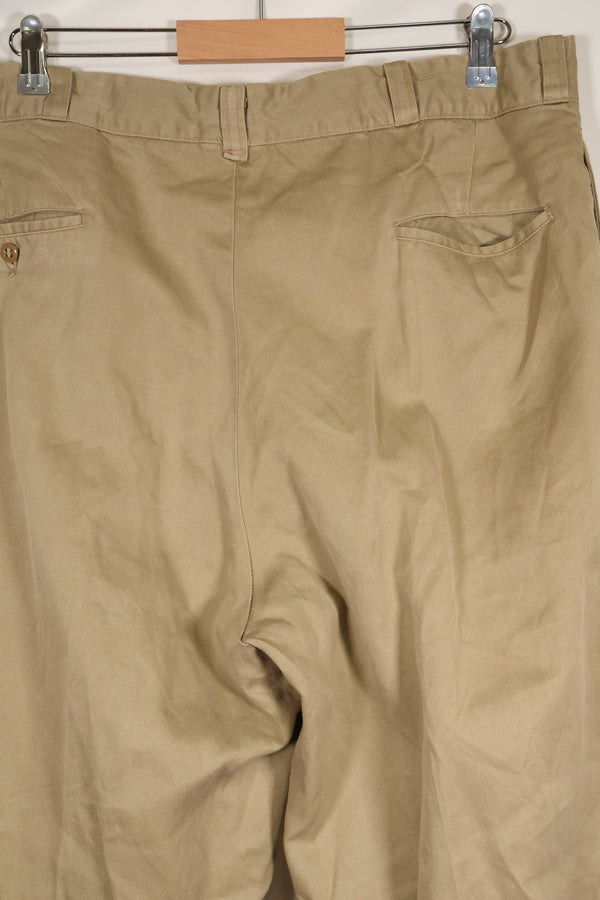 1960s, estimated 34-36 US Army cotton khaki pants, used.