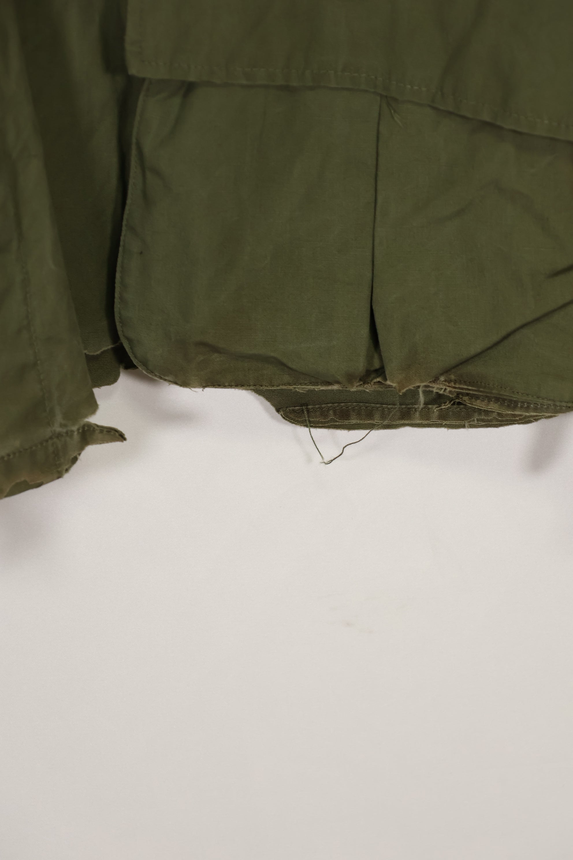 Real 1966-1967 3rd Model Jungle Fatigue Jacket L-R with damage.