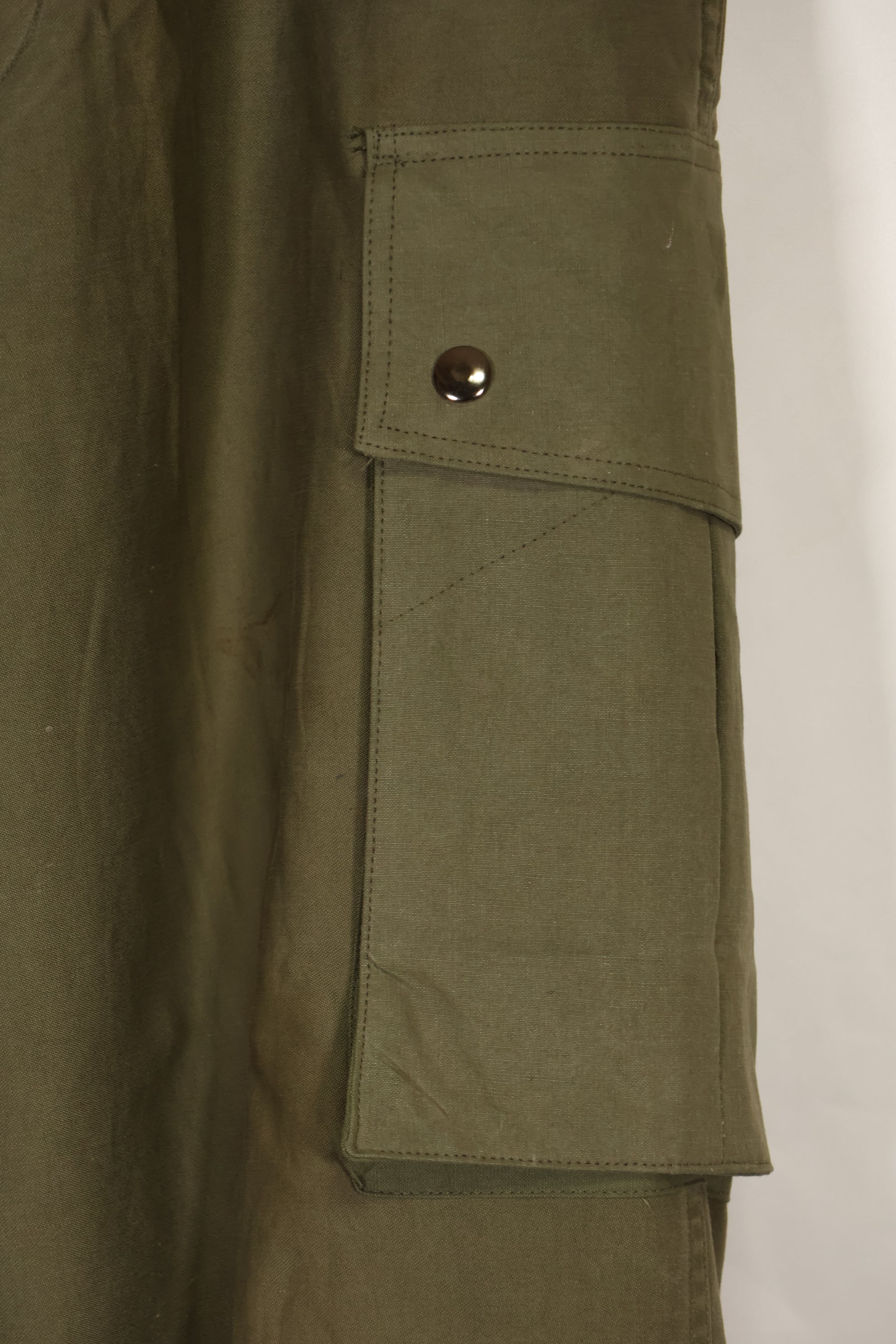 Real U.S. Army M45 pants with additional pocket modification, used.