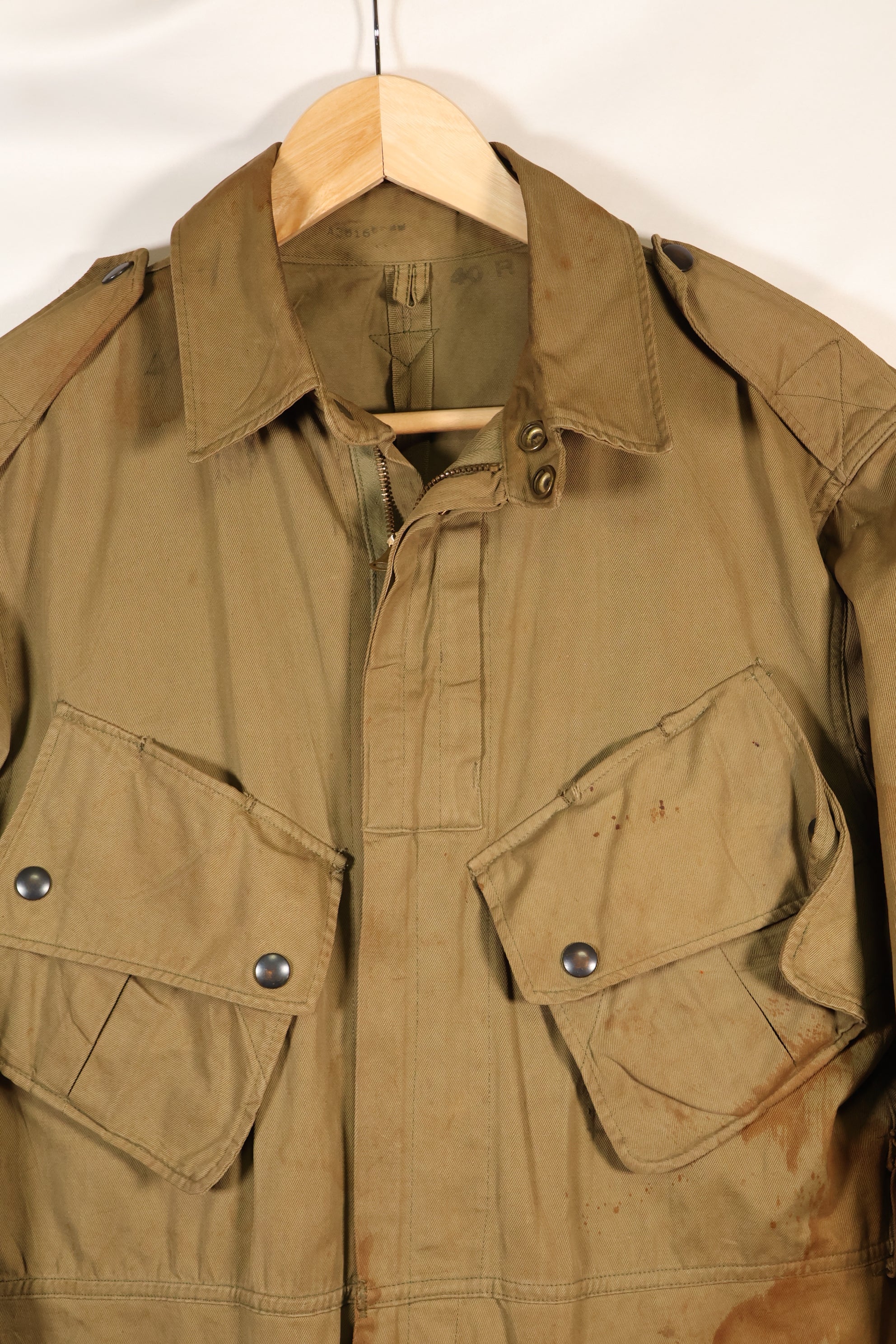 1940s 40R WWII M42 jump jacket without waist belt, stained, used.
