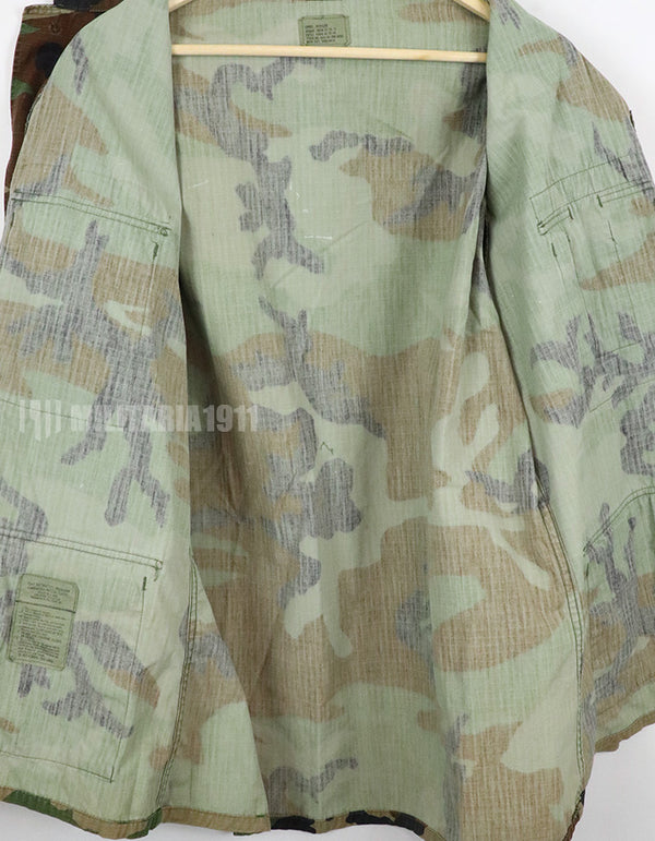 US SURPLUS U.S. Army Special Forces Woodland Camouflage Jacket, 1996, with patches.