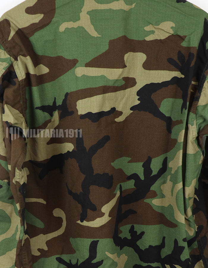 Real U.S. Army Woodland Camouflage Jacket, 2000, with patches.