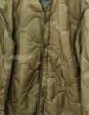 U.S. Army M65 Field Jacket Liner, 1988, partially damaged.