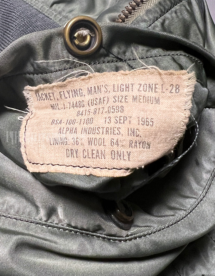 Real 1965 USAF L-2B flight jacket, knit restored, zipper damaged.